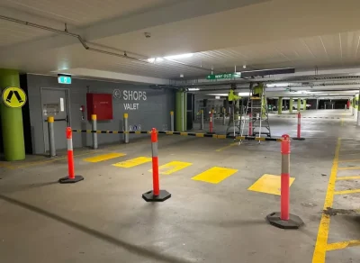 Real-time parking signage installation at Westfield Carousel including electrical and digital systems.