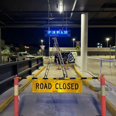 Real-time parking signage installation at Westfield Carousel including electrical and digital systems.