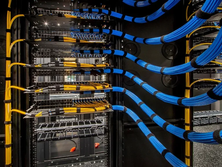 Structured cabling installation featuring organised data server racks with TV distribution, data and fibre pathways completed for a commercial project in Perth, supporting broader electrical, communications and operational requirements.