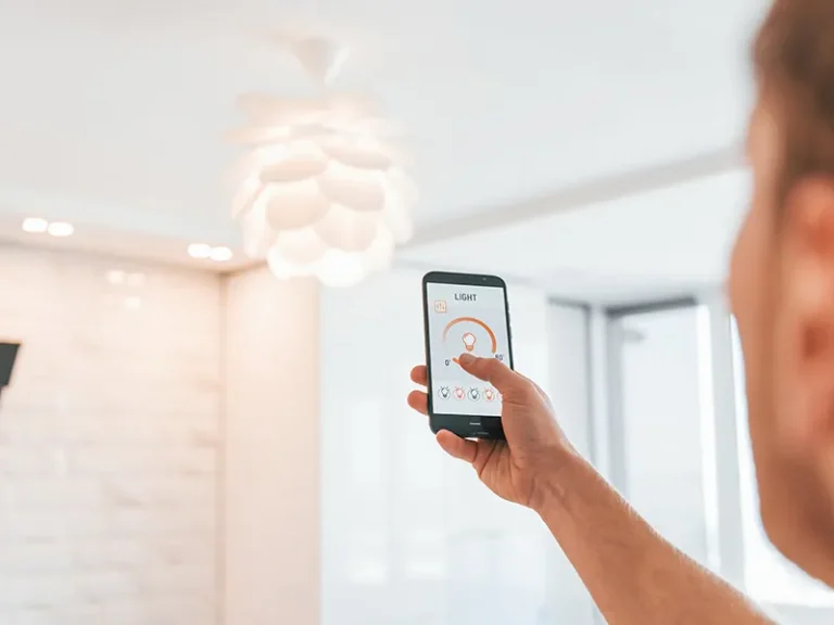 Home automation system in a Perth residential project showing smart lighting control via mobile device, integrating security, data and communications infrastructure for coordinated smart-home functionality.